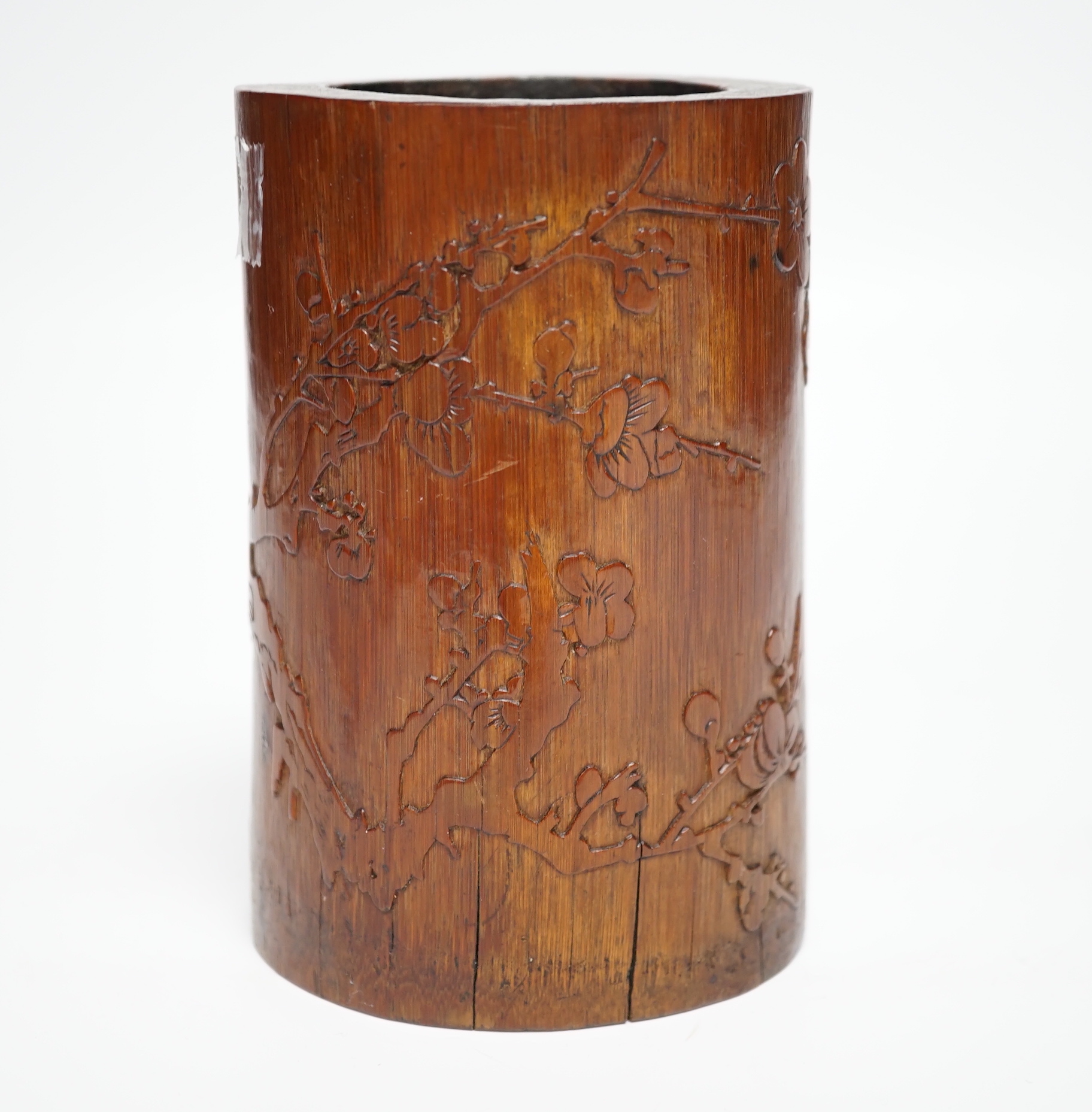 A 19th century Chinese Daoist bamboo brushpot, inscribed with a poem, 13cm high